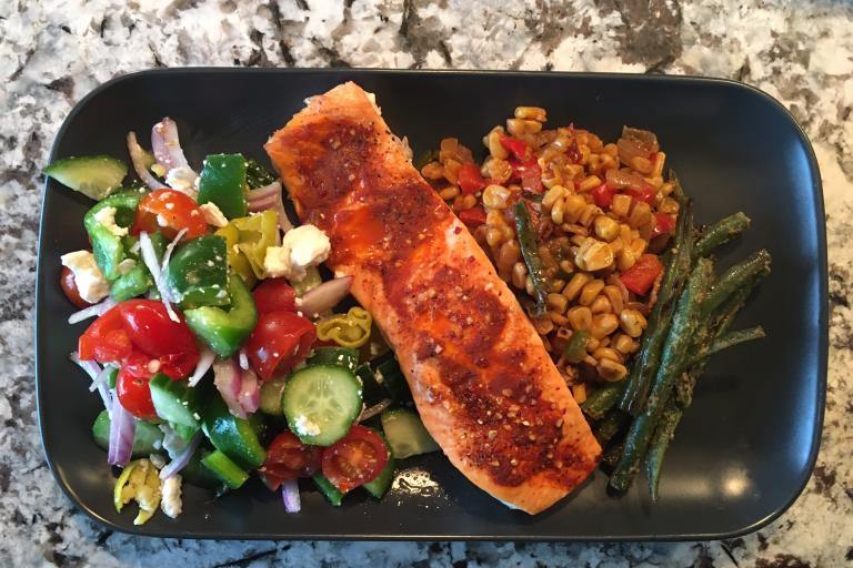 Corn, salmon, beans and Greek salad.